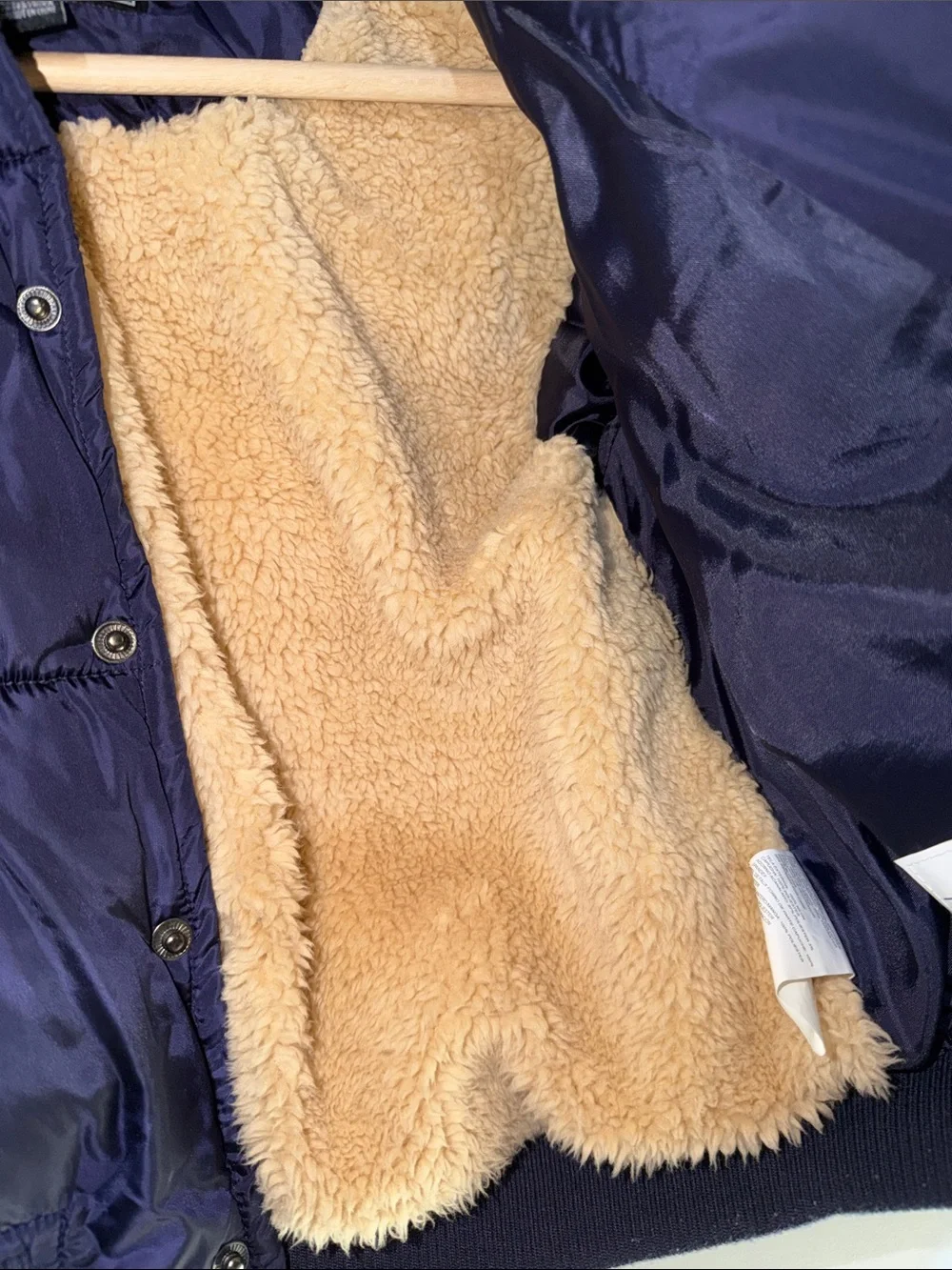 Rothschild Kids varsity puffer jacket features a navy blue puffer body 4T